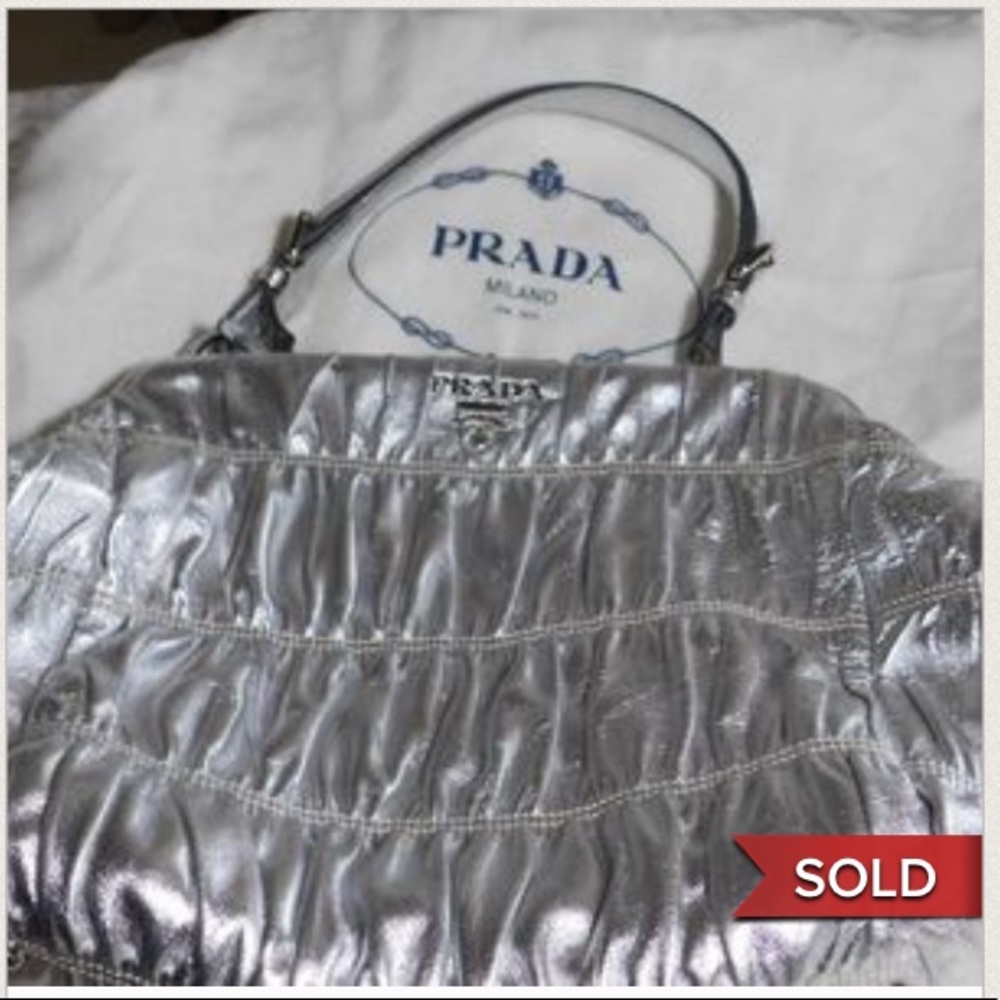 100% EUC Silver Prada